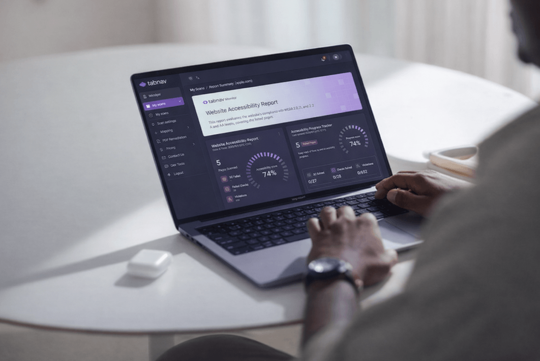 Person reviewing ADA compliance testing results on a laptop, showing an accessibility report with scores, failed checks, and compliance progress indicators.