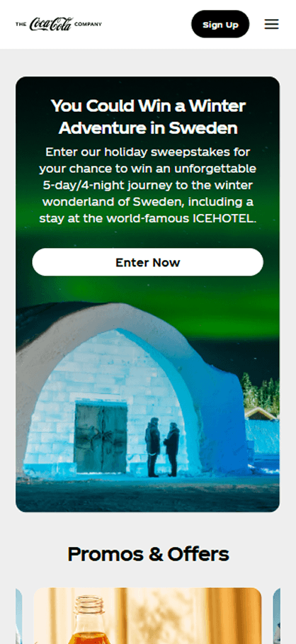 Mobile view of the Coca-Cola website demonstrating responsive layout, accessible navigation, and touch-friendly buttons on an ADA-compliant website.