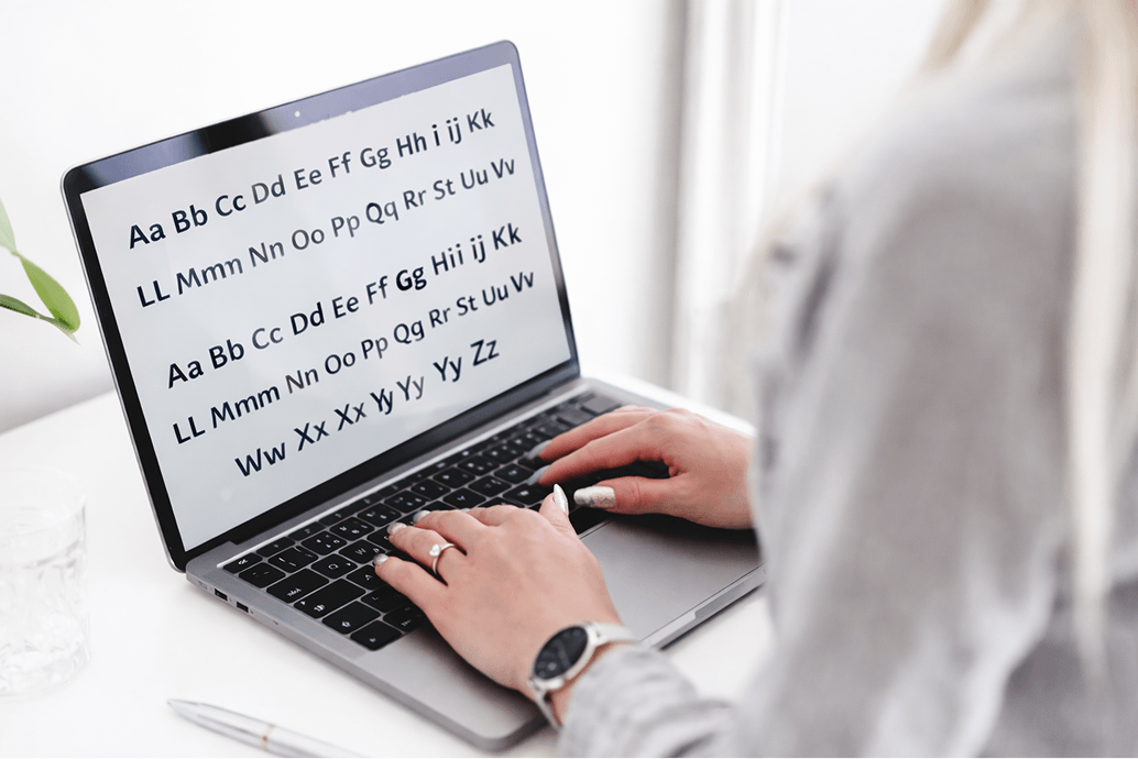 Font accessibility example showing clear letterforms and readable typography displayed on a laptop screen.